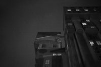 a black and white photo of a building at night